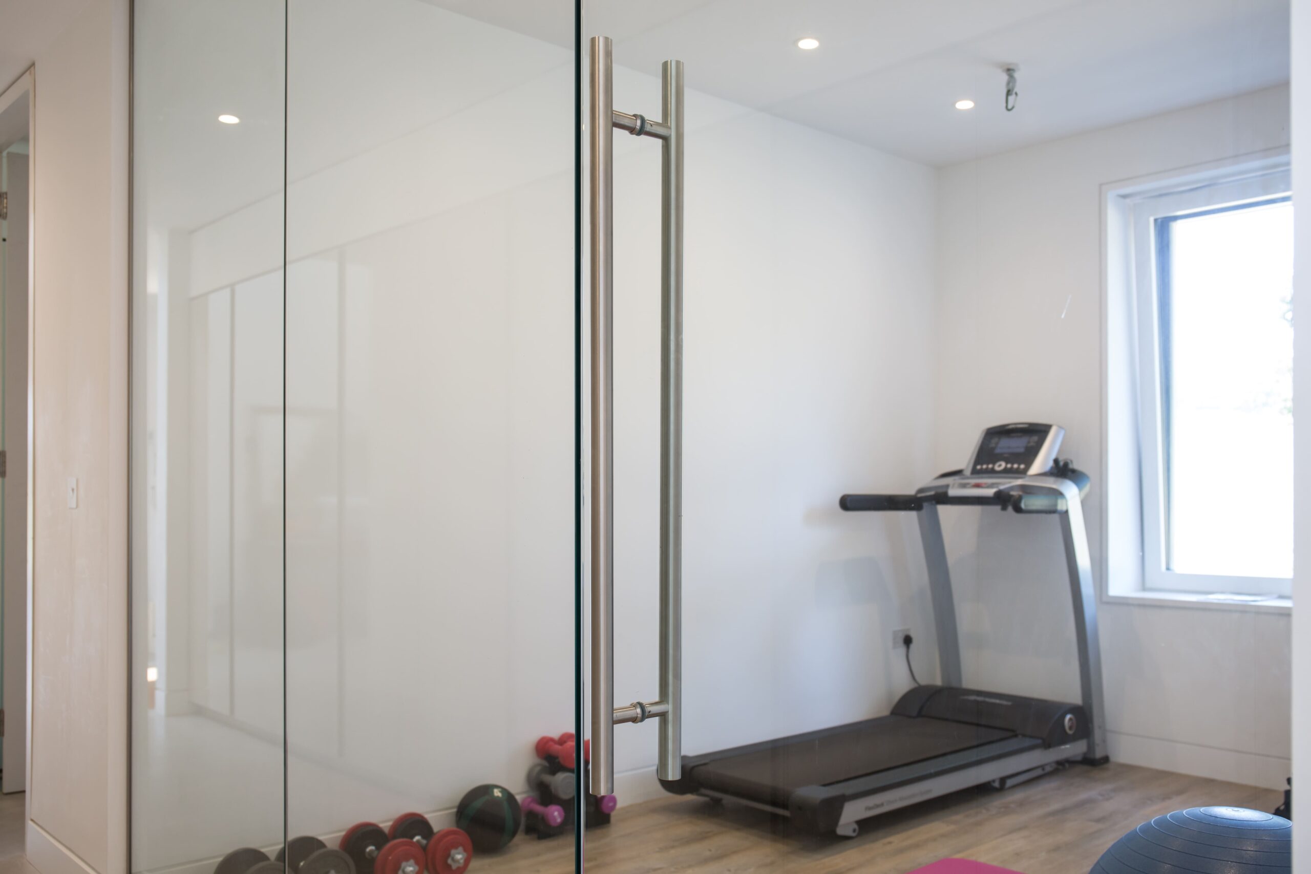bespoke frameless glass door installed in a commercial property in bristol