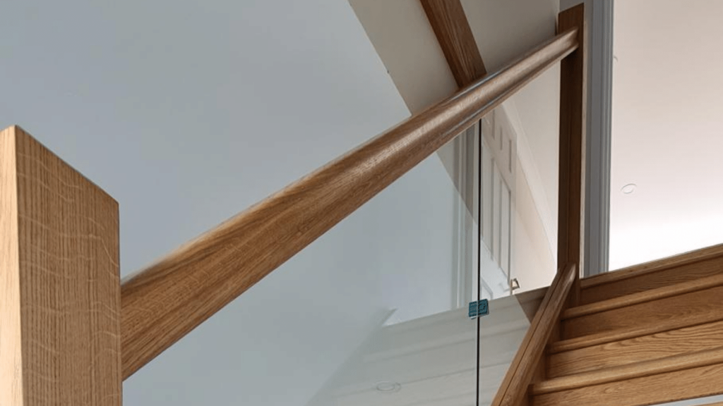 A staircase with embedded glass balustrades
